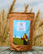 The Deep Soil Wheat Flour Gehun Ka Atta package on wooden table with golden wheat field background