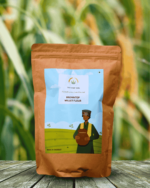 The Deep Soil Browntop Millet Flour package on wooden table with green millet stalks background