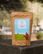 The Deep Soil Pahadi Gluten Free Flour Mix brown paper package on a stone surface with nature background