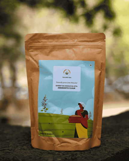 The Deep Soil Gharat Ka Chaulai Ka Atta Amaranth Flour brown paper package on a stone surface with nature background