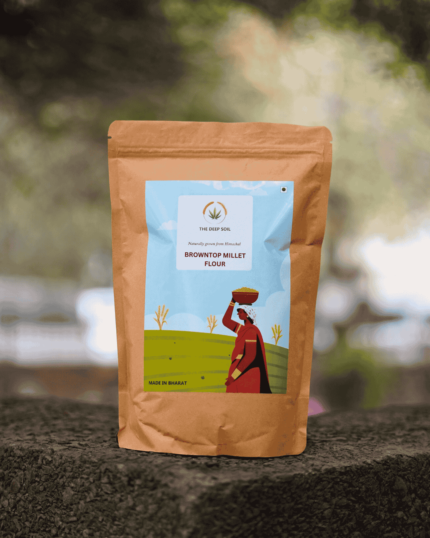 The Deep Soil Browntop Millet Flour Hari Kangni Atta brown paper package on a stone surface with nature background