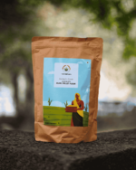 The Deep Soil Pearl Millet Flour Bajra Ka Atta brown paper package on a stone surface with nature background