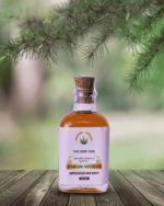 The Deep Soil Pahadi Shahad Unprocessed Raw Honey 100ml bottle on wooden table with pine branches
